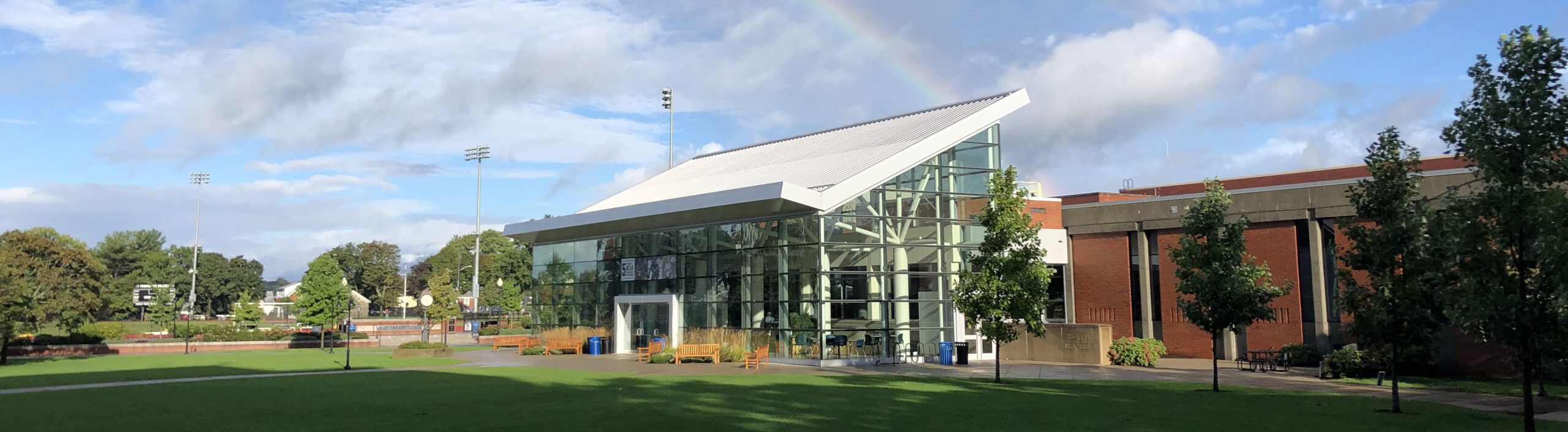 photo of outside of slavin center with a rainbow in the sky